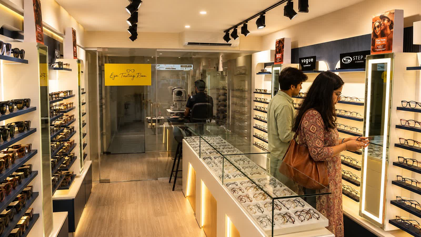 Customers choosing frames with help at Panorama Vision, Jalgaon